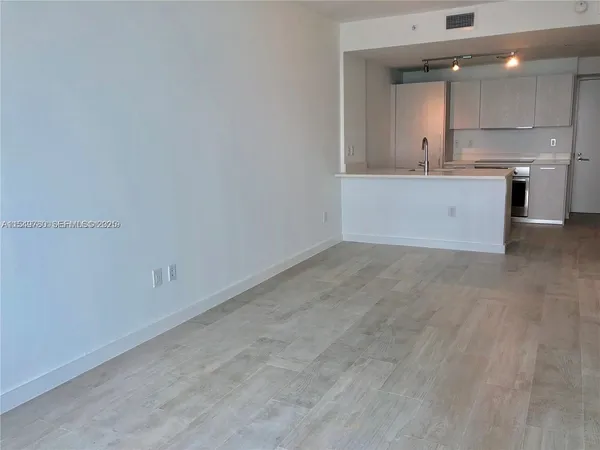 a view of a kitchen with a sink