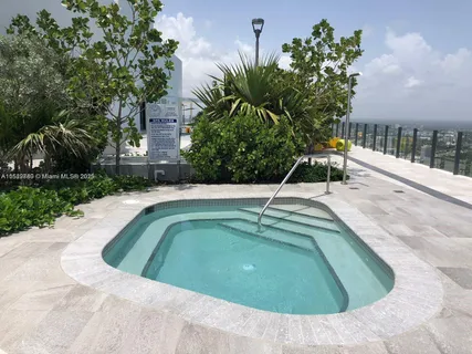 a view of a swimming pool with a patio