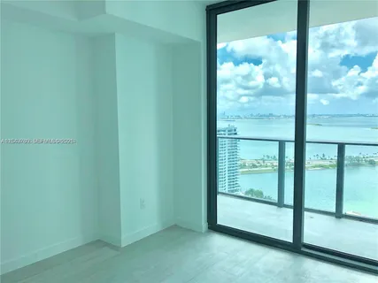 a view of empty room with sliding door