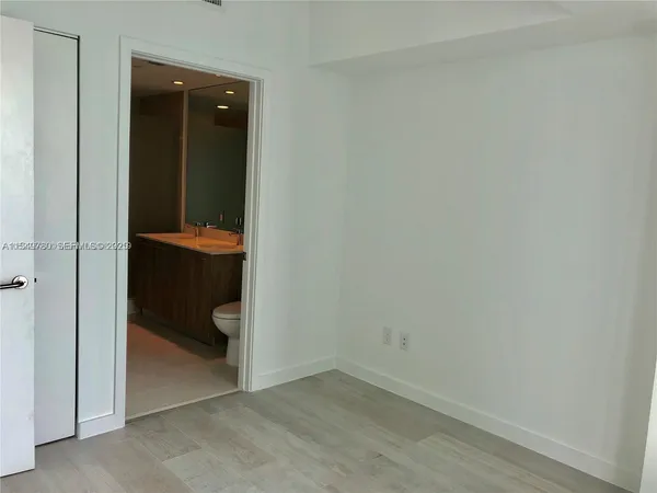 an empty room and a sink