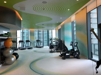 a view of swimming pool with outdoor seating and yard in back