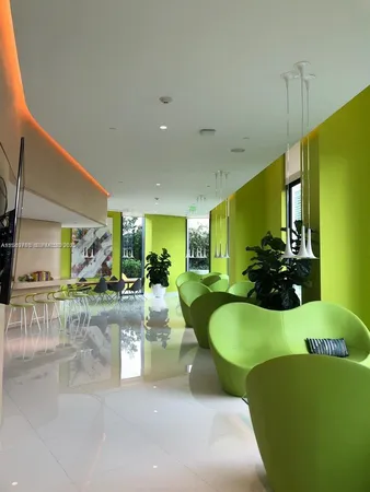 a room with lots of tables and chairs