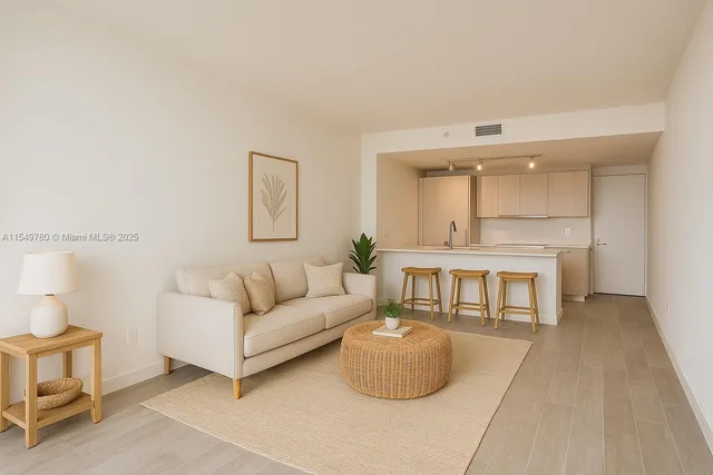 a living room with furniture a rug and a large window