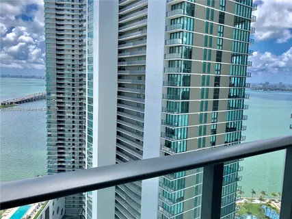 a view of a balcony with a tree