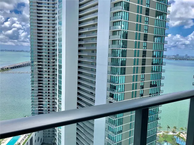 a view of a balcony with a tree