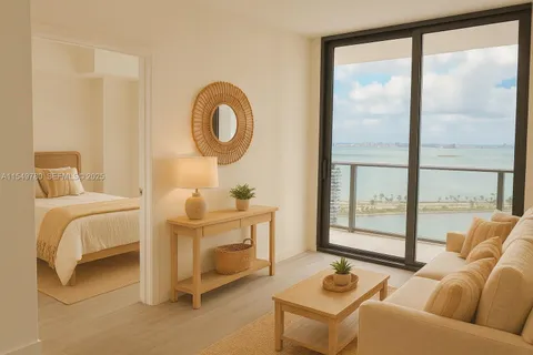a living room with furniture a rug and a large window