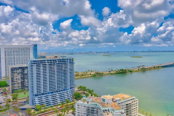a view of a lake and tall building