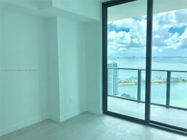 a view of empty room with sliding door