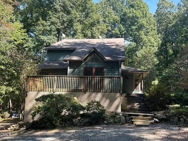 a view of a house with a small yard