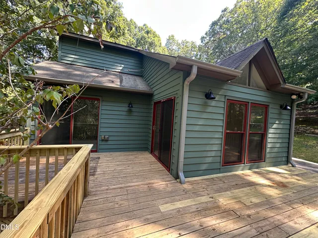 a view of outdoor space and deck of the house
