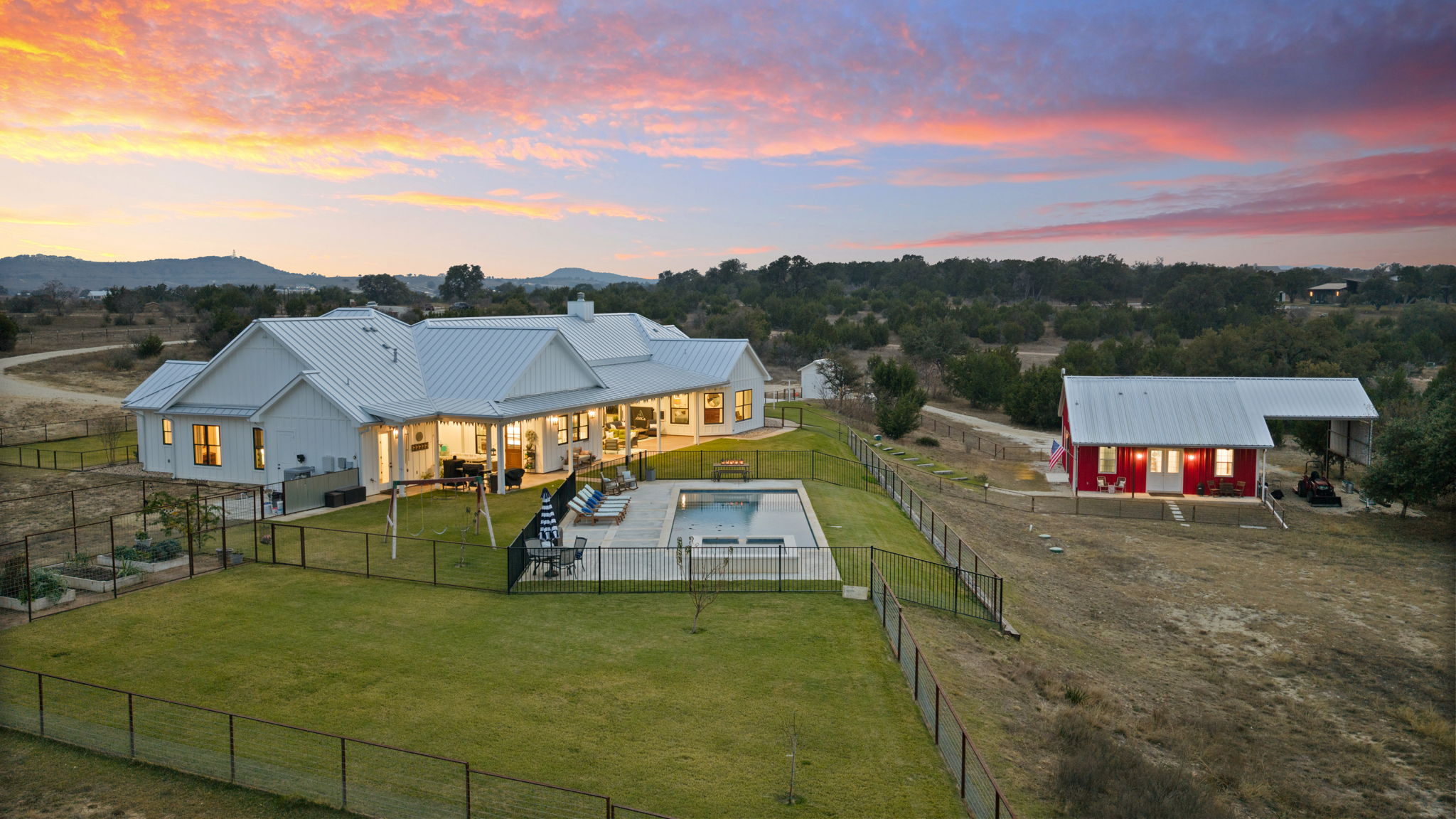 452 Southwick Ranch Road Johnson City, TX 78636 - Photo 37 of 40 a view of a big house with a big yard and potted plants