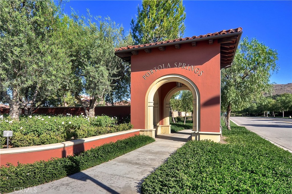 123 Quiet Grove Irvine, CA 92618 - Photo 13 of 16 a front view of a house with a porch