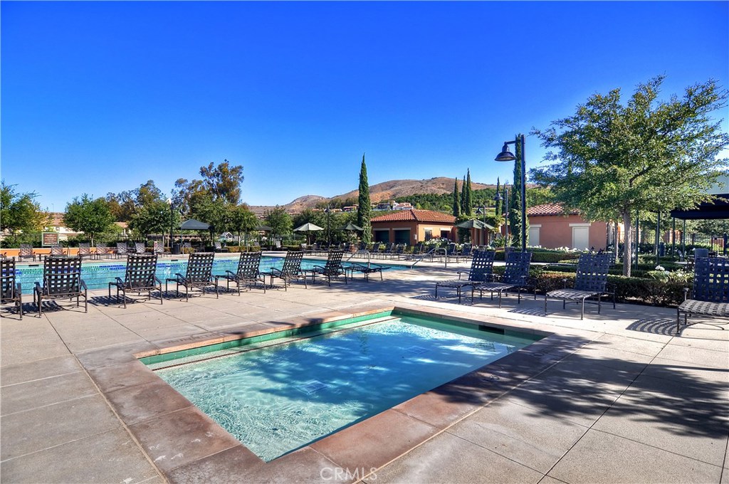 123 Quiet Grove Irvine, CA 92618 - Photo 14 of 16 a swimming pool with outdoor seating and yard