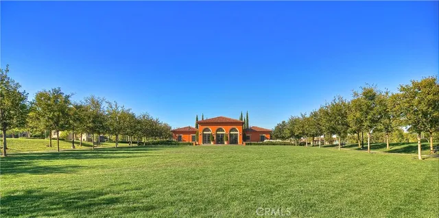 a view of a park with swings and slides