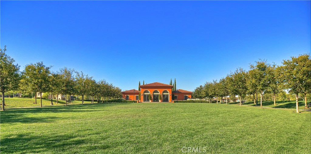 123 Quiet Grove Irvine, CA 92618 - Photo 15 of 16 a front view of a house with a yard