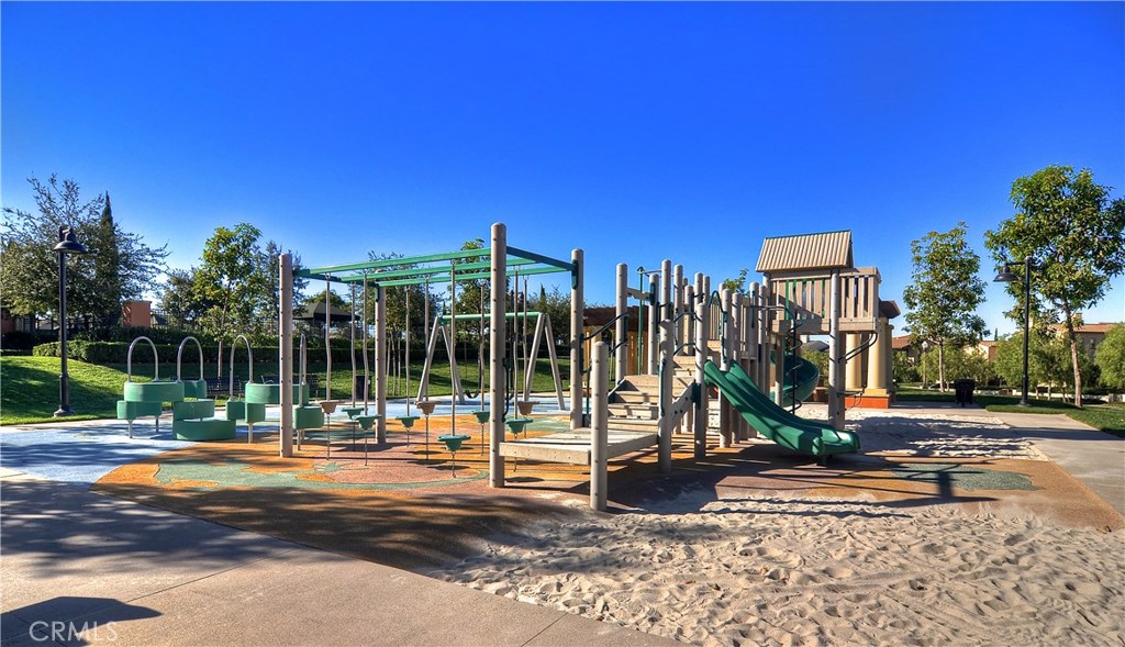 123 Quiet Grove Irvine, CA 92618 - Photo 16 of 16 a view of a park with swings and slides