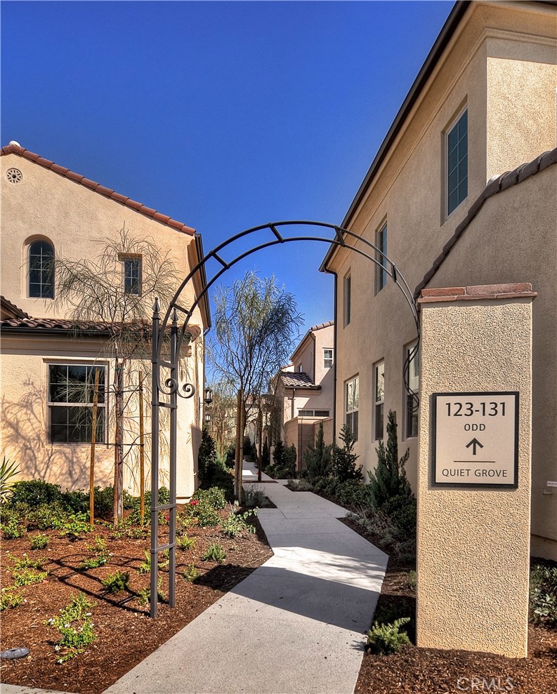 123 Quiet Grove Irvine, CA 92618 - Photo 2 of 16 a view of a house with street