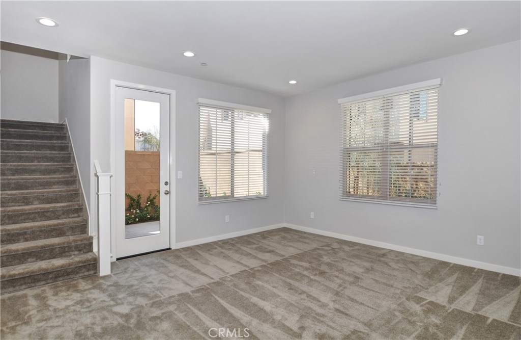 123 Quiet Grove Irvine, CA 92618 - Photo 6 of 16 a view of an empty room with a window