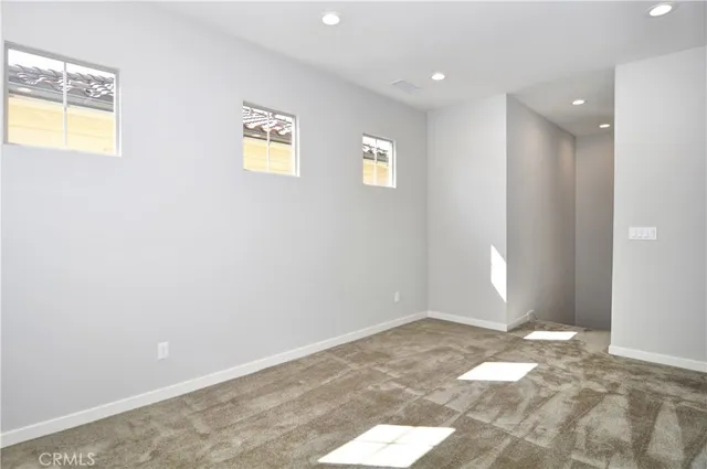 a view of an empty room and window