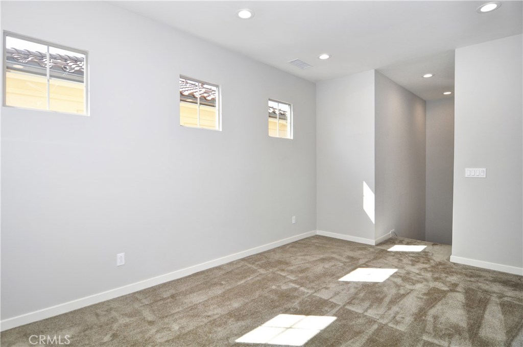 123 Quiet Grove Irvine, CA 92618 - Photo 7 of 16 a view of an empty room and window