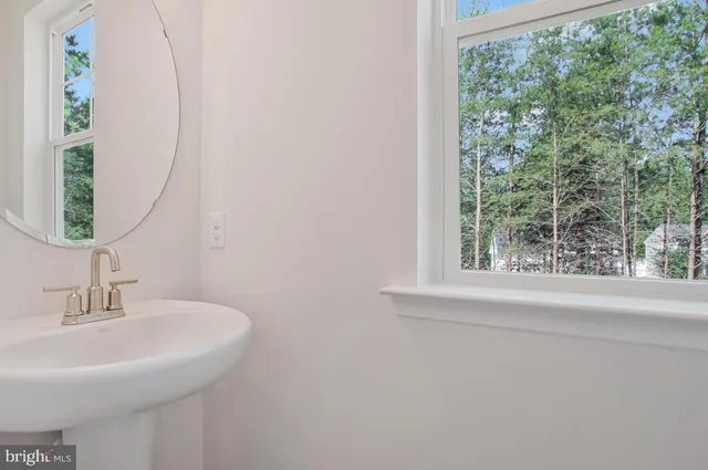 a view of an empty room and a window