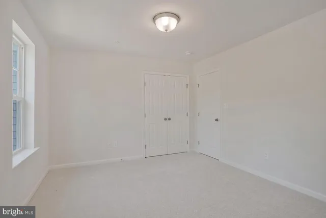 a bathroom with double vanity sink and a mirror