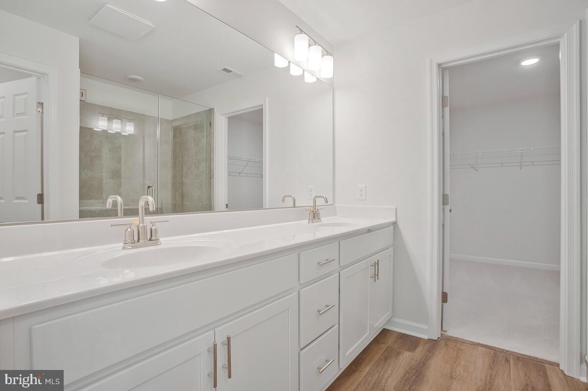 900 Walnut Avenue North Beach, MD 20714 - Photo 33 of 82 a bathroom with double vanity sink and a mirror