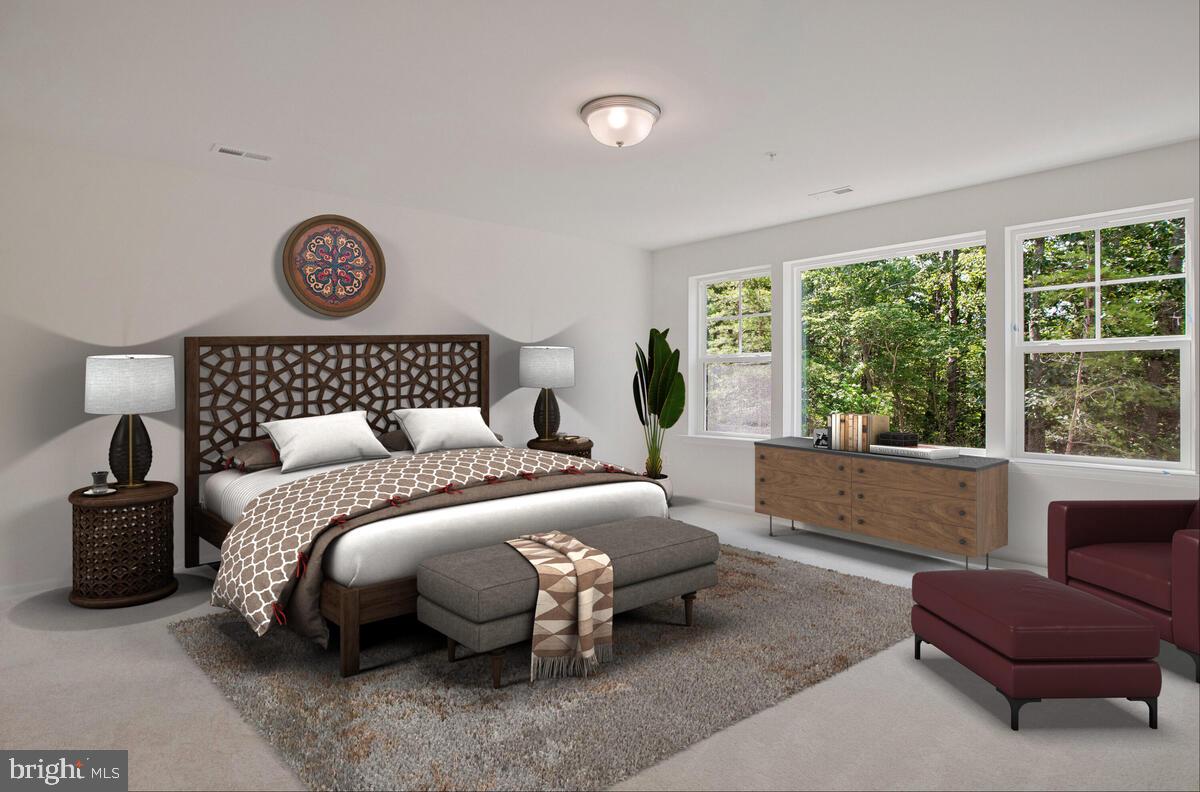 900 Walnut Avenue North Beach, MD 20714 - Photo 39 of 82 a bedroom with a bed and a large window