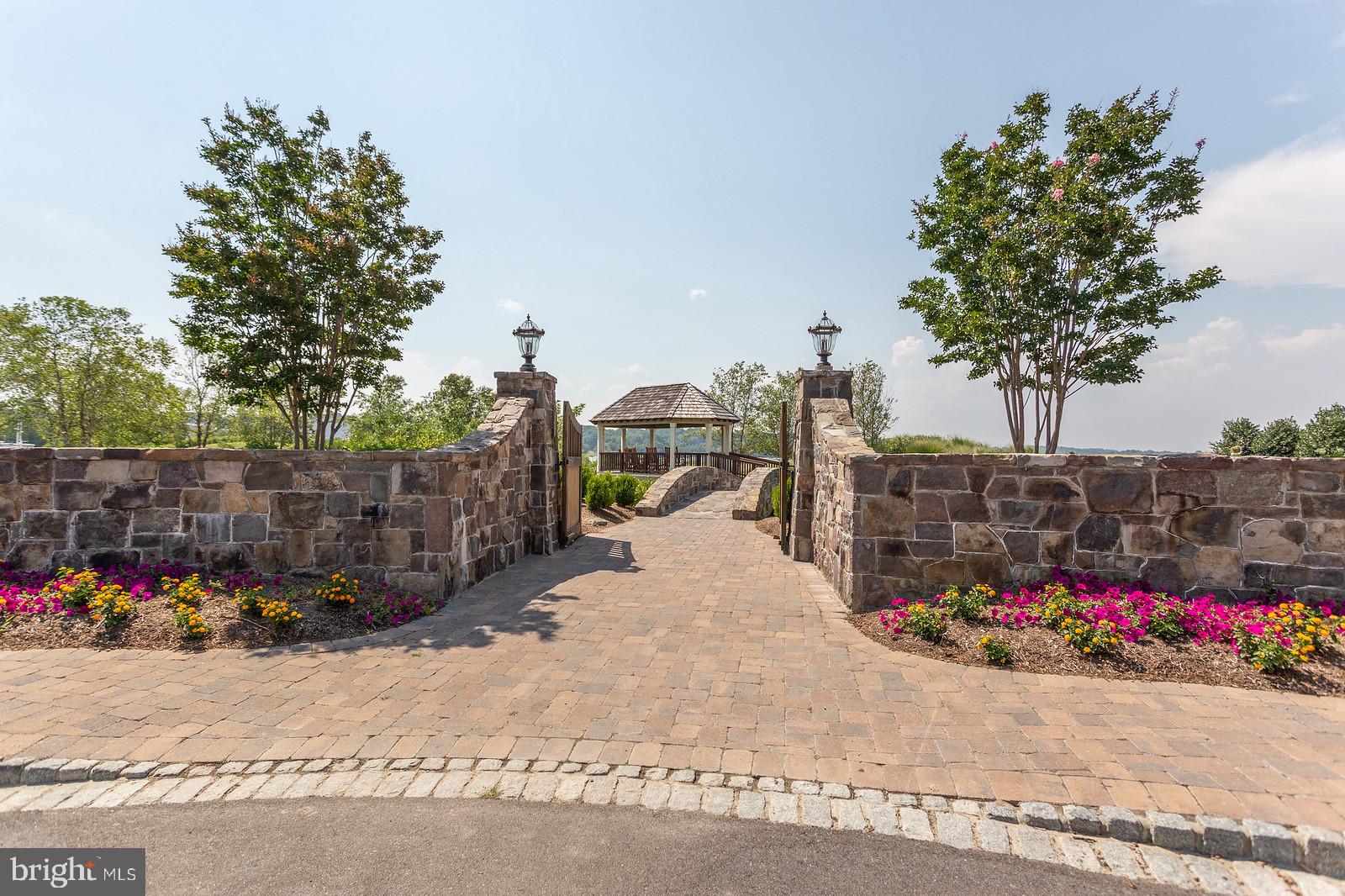 900 Walnut Avenue North Beach, MD 20714 - Photo 53 of 82 a street view with a couple of cars parked on road in front of house
