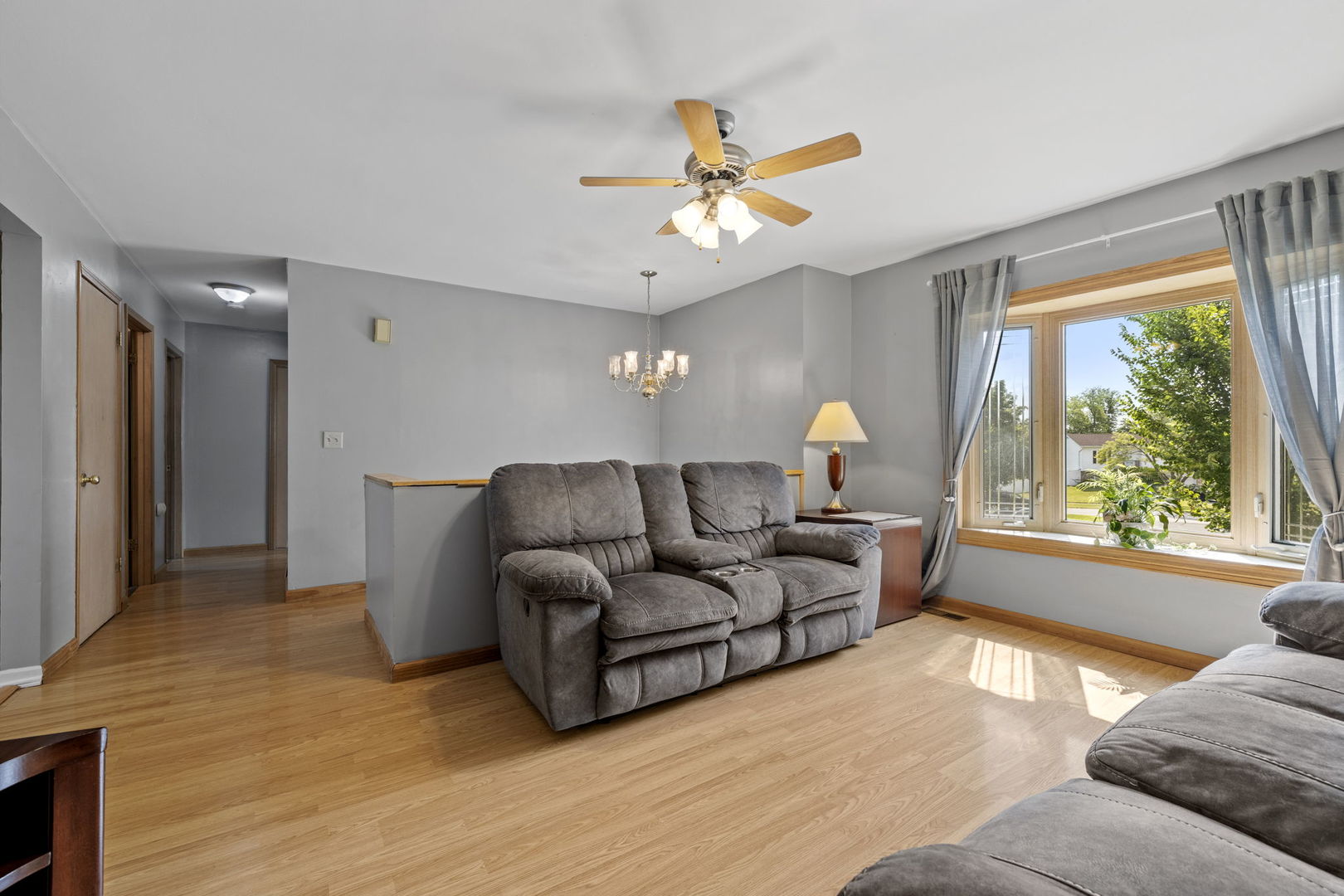 244 Oak Ridge Court Bolingbrook, IL 60440 - Photo 4 of 26 a living room with furniture and a large window