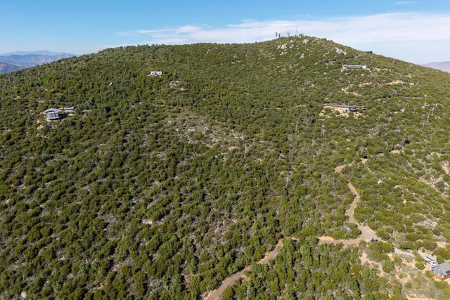 a view of a large building with a mountain in the background