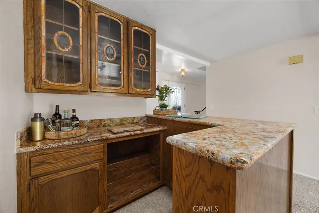 a kitchen with stainless steel appliances granite countertop a stove and a sink