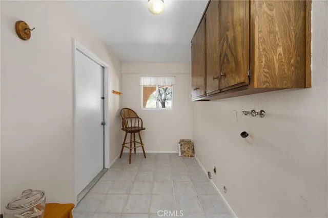 a view of a livingroom with furniture and staircase