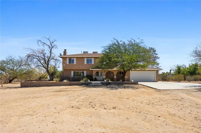 a view of a house with a snow in the yard