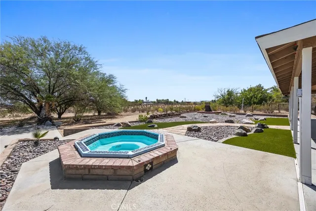 a view of garage with a car parked front of it