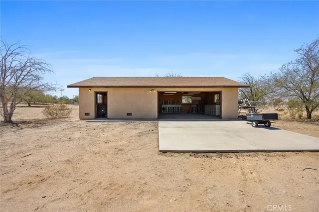 a view of empty room with wooden ceiling