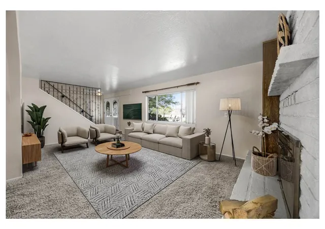 a living room with furniture and a rug