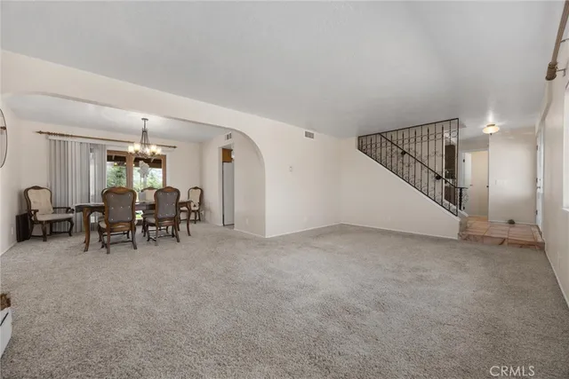 a view of a livingroom with furniture and white walls