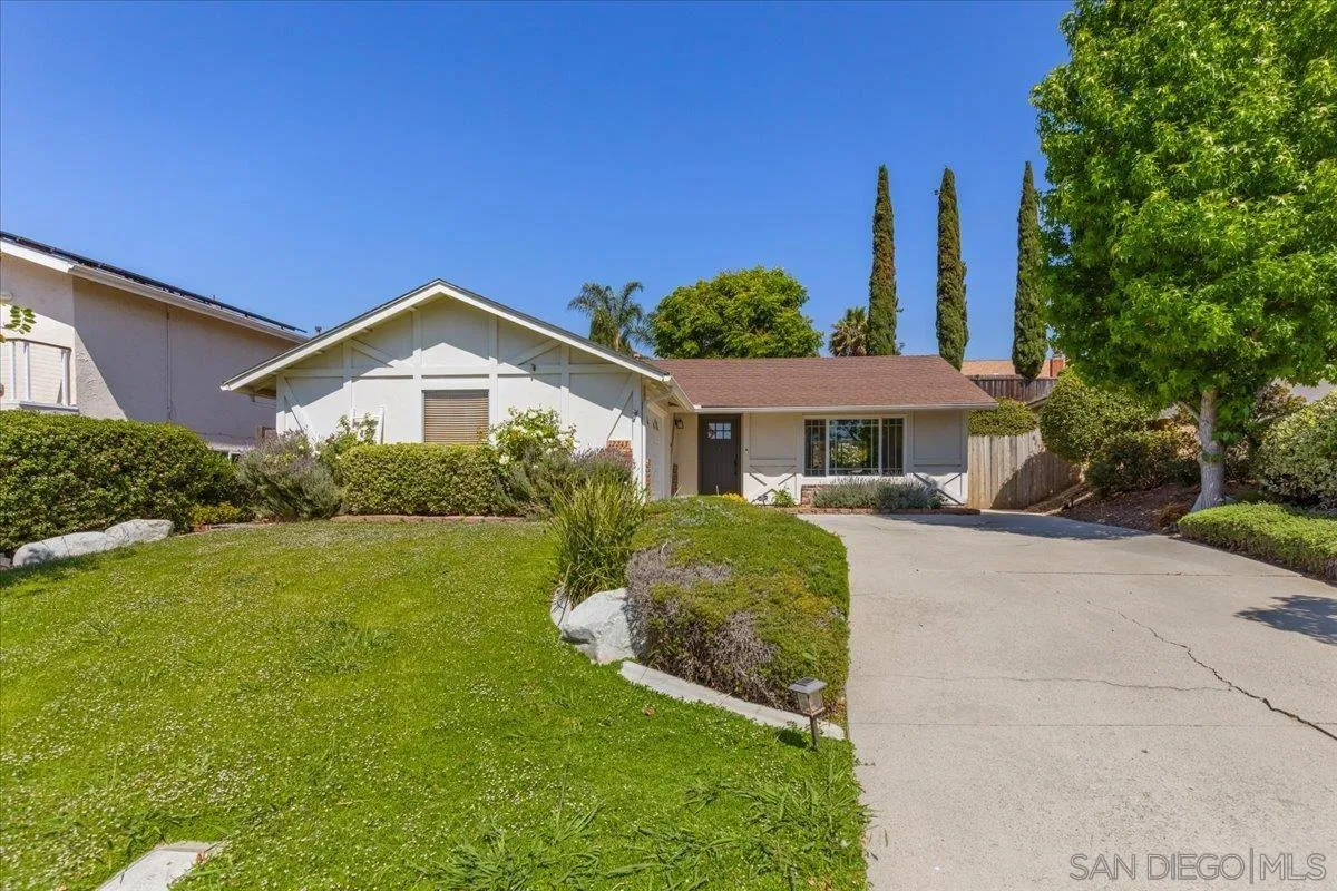 12243 Buckskin Trail Poway, CA 92064 - Photo 1 of 41 a front view of a house with yard and green space