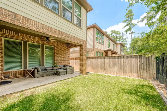 a row of trees in front of a building