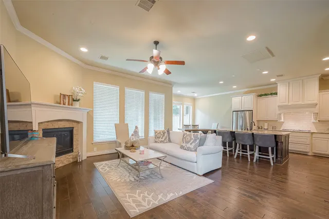 a living room with furniture fireplace and flat screen tv