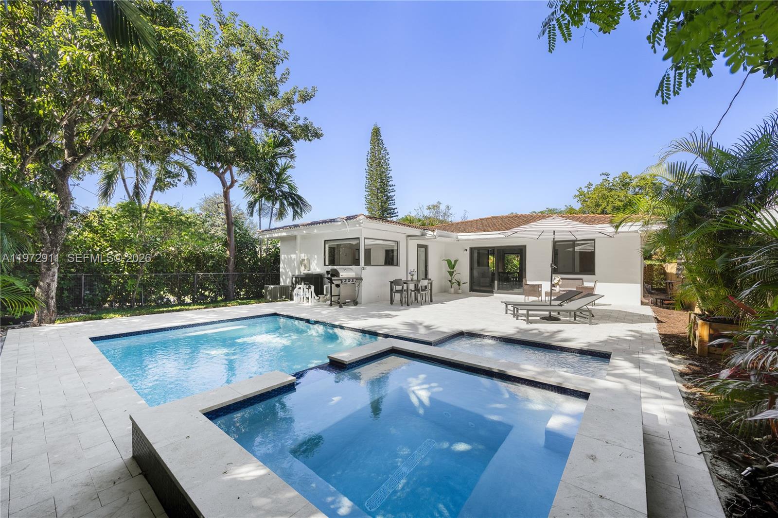1860 Southwest 13th Street Miami, FL 33145 - Photo 1 of 21 a front view of house with yard and outdoor seating