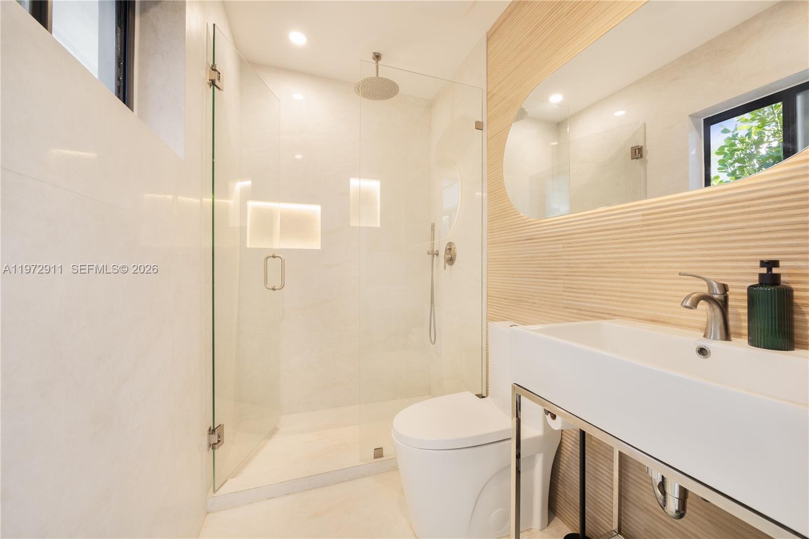 1860 Southwest 13th Street Miami, FL 33145 - Photo 12 of 21 a bathroom with a bathtub shower sink vanity and toilet