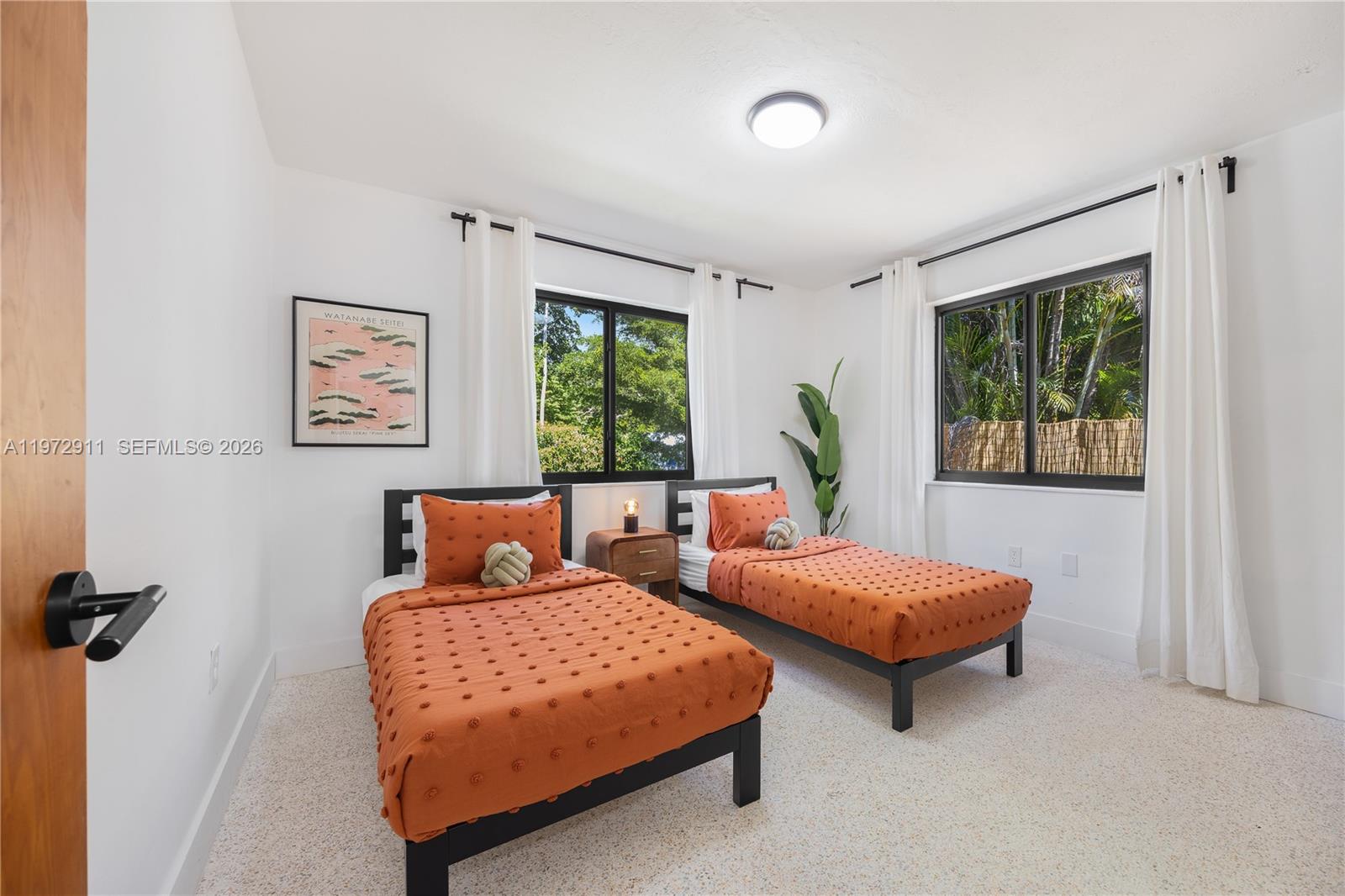 1860 Southwest 13th Street Miami, FL 33145 - Photo 16 of 21 a bedroom with two beds and a window