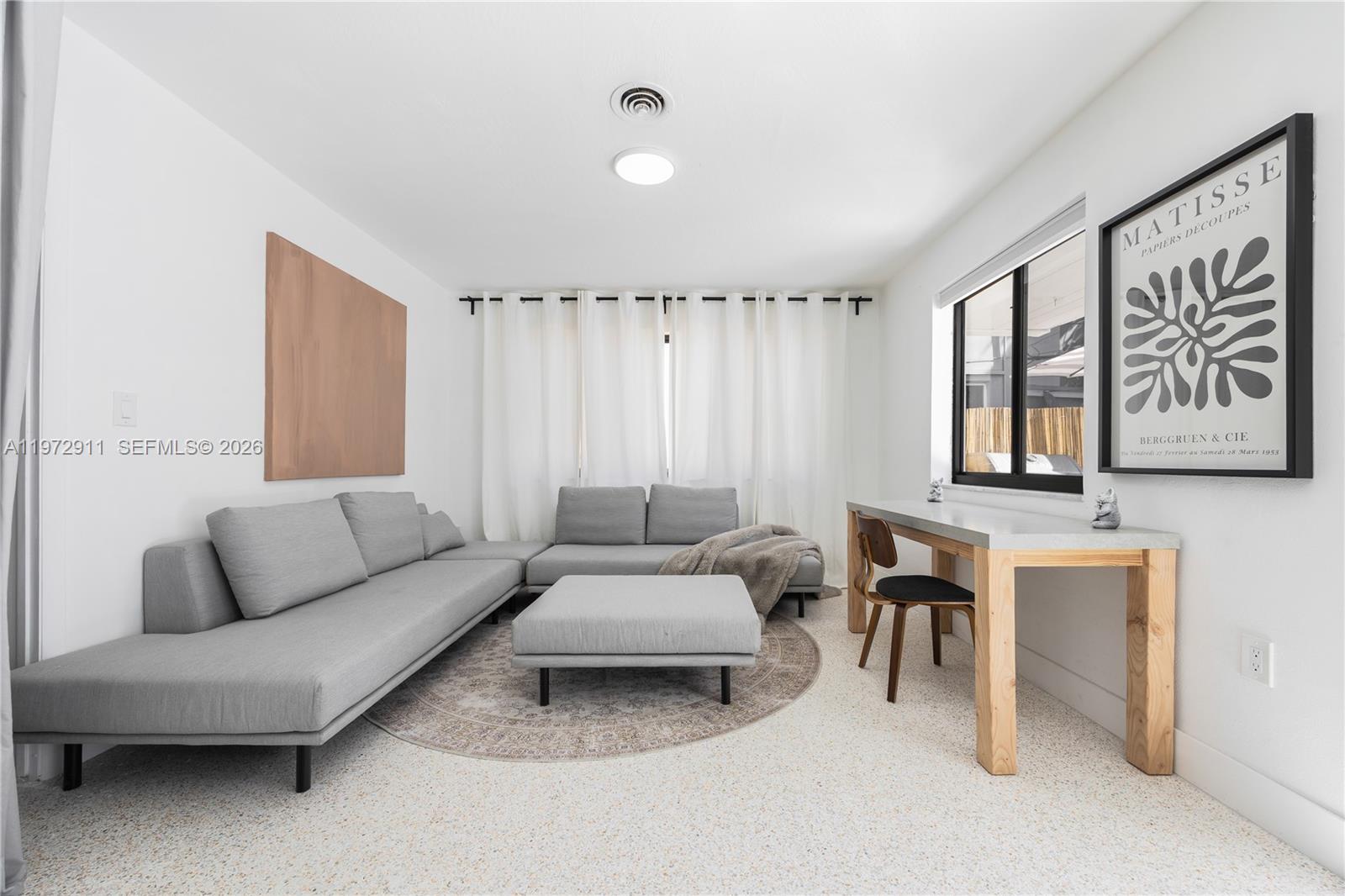 1860 Southwest 13th Street Miami, FL 33145 - Photo 17 of 21 a living room with furniture and a large window