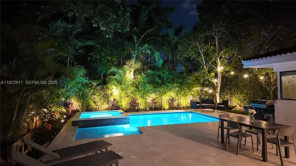 an outdoor space with lounge chair