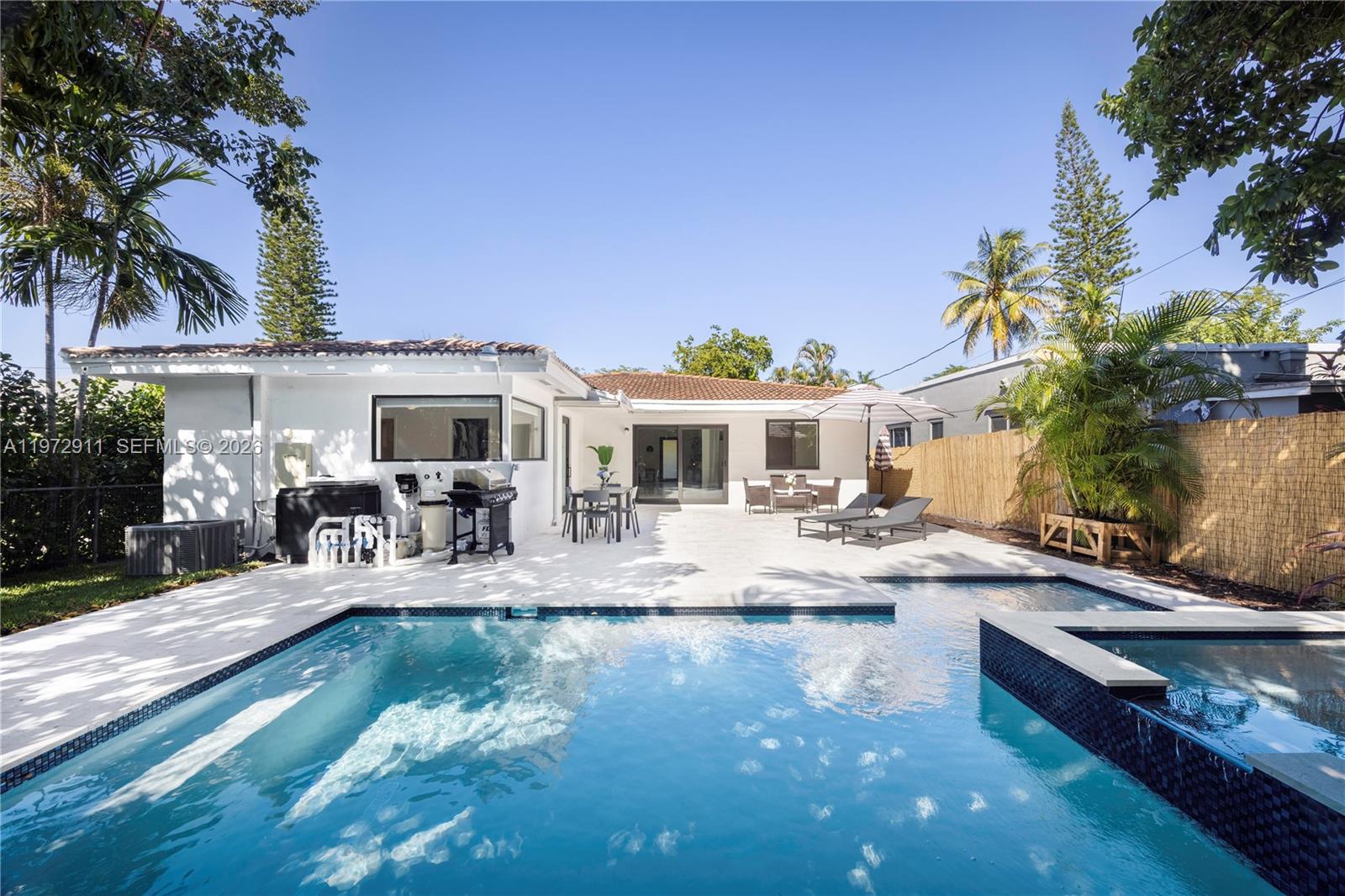 1860 Southwest 13th Street Miami, FL 33145 - Photo 21 of 21 a view of swimming pool with outdoor seating and house in the background