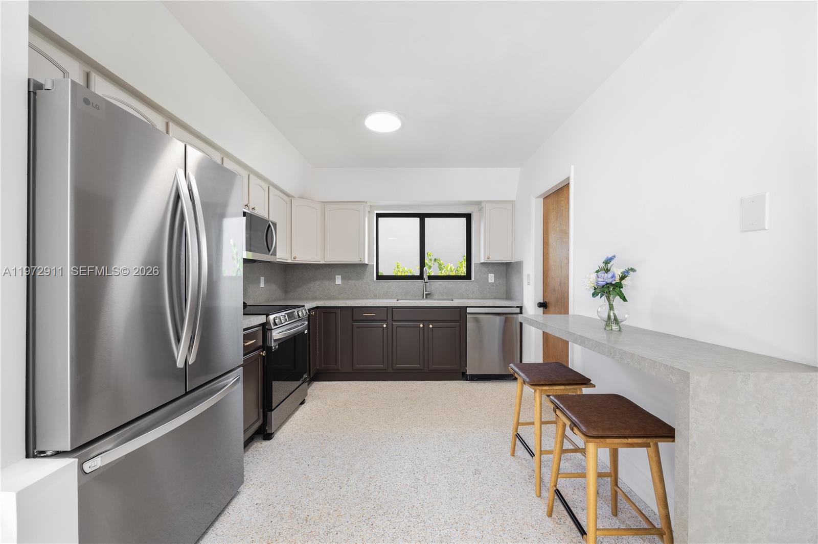 1860 Southwest 13th Street Miami, FL 33145 - Photo 5 of 21 a kitchen with a refrigerator and a sink