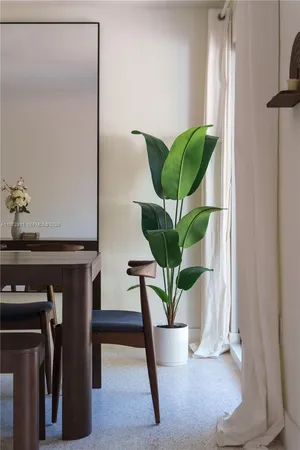 a vase of flowers sitting on a table