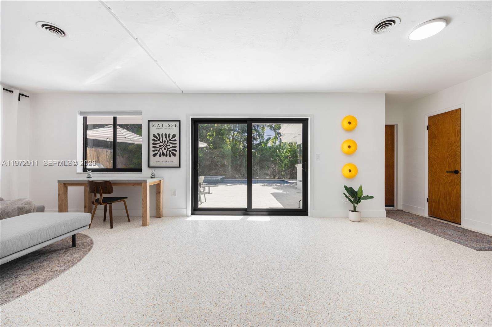 1860 Southwest 13th Street Miami, FL 33145 - Photo 6 of 21 a view of a livingroom with furniture and a flat screen tv